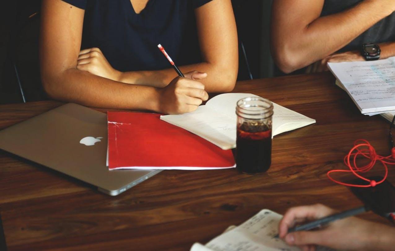 People studying at a meeting, to indicate training. CC0 from pexels.com