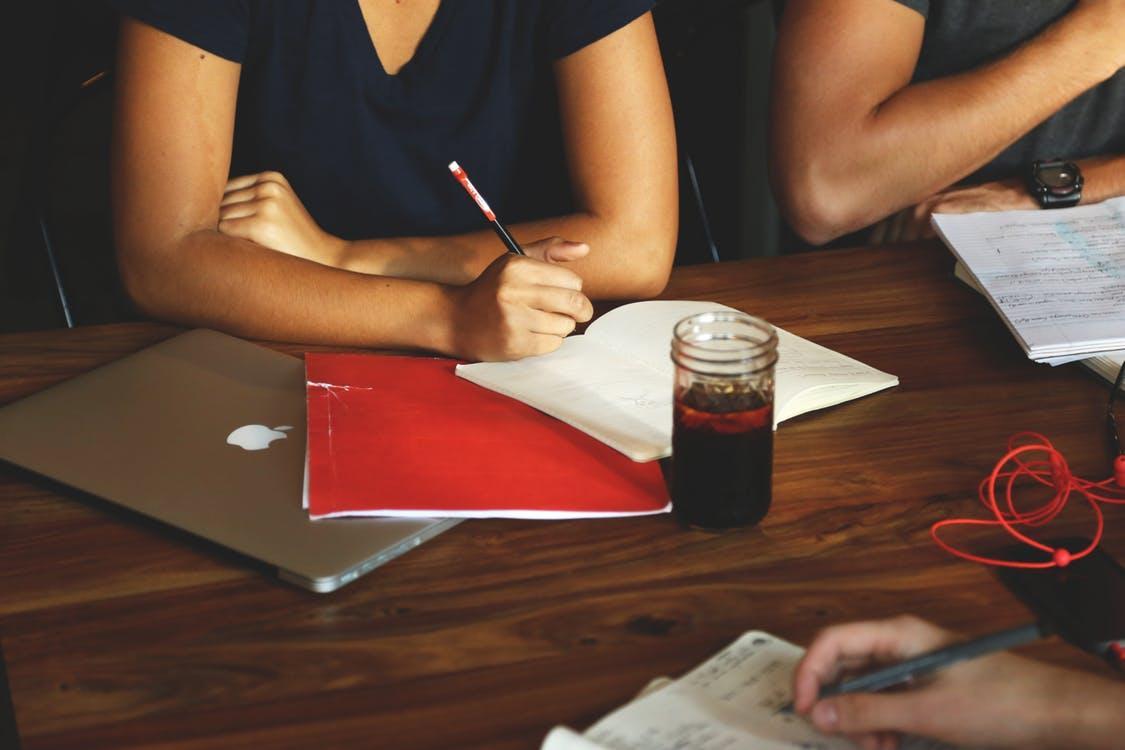 People studying at a meeting, to indicate training. CC0 from pexels.com