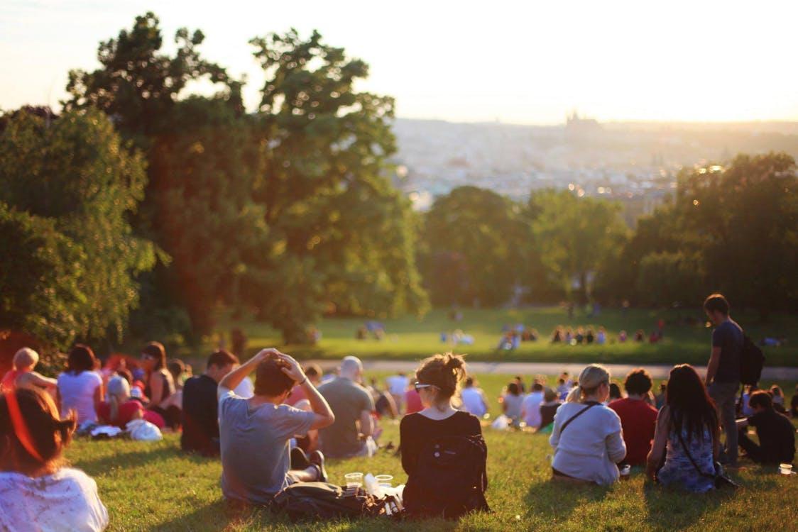 People sitting at a beautiful park, to indicate a fun event, CC0 pexels.com